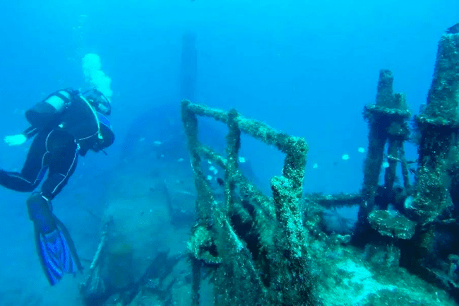 Divers at a ship wreck in St Helena
