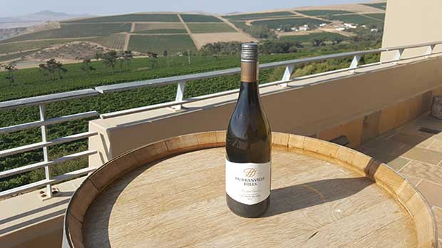 Red wine bottle on restaurant deck at Durbanville Hills