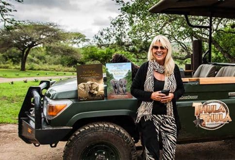 Francoise Malby-Anthony posing with her books