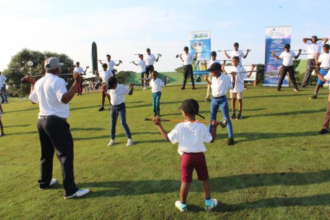 IMAGE: young golfers stretching