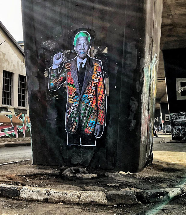 Graffiti of Nelson Mandela in Johannesburg by street artist ThePostmanArt
