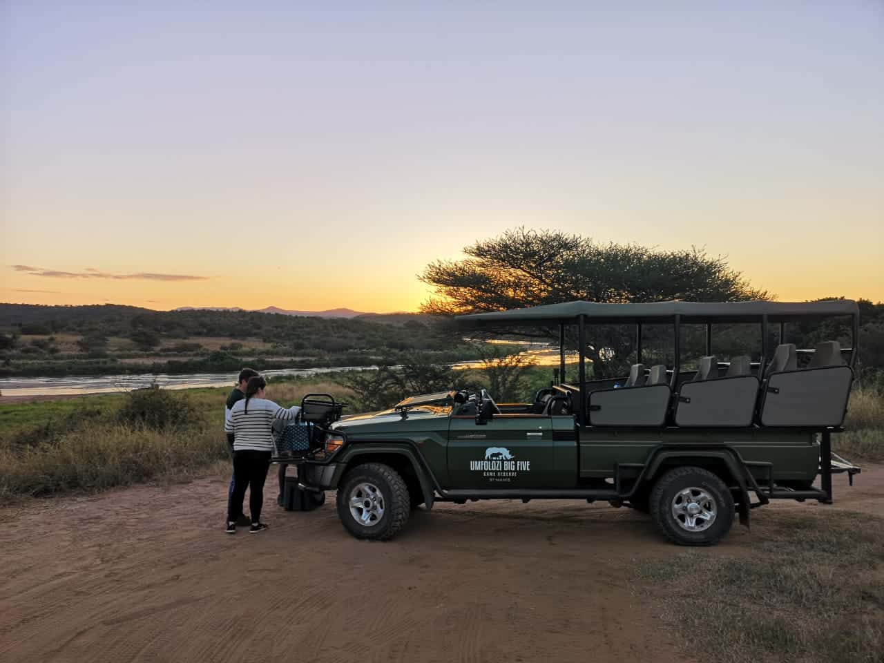 Game drive vehicle and guests